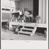 Camp member on porch of her shelter at Osceola migratory labor camp. Belle Glade, Florida