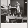 Camp member on porch of her shelter at Osceola migratory labor camp. Belle Glade, Florida