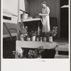 Camp member on porch of her shelter at Osceola migratory labor camp. Belle Glade, Florida