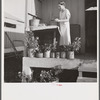 Camp member on porch of her shelter at Osceola migratory labor camp. Belle Glade, Florida