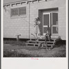 Children coming into utility building after their showers. It is also equipped with complete laundry facilities. Osceola migratory labor camp, Belle Glade, Florida