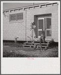 Children coming into utility building after their showers. It is also equipped with complete laundry facilities. Osceola migratory labor camp, Belle Glade, Florida