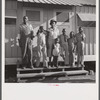 The Robinson family outside their shelter at Okeechobee migratory labor camp. Belle Glade, Florida