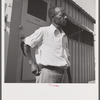 Camp member moving into shelter at Okeechobee migratory labor camp. Belle Glade, Florida
