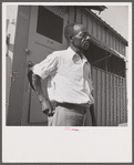 Camp member moving into shelter at Okeechobee migratory labor camp. Belle Glade, Florida