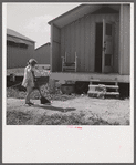 Camp members' children are taking an interest in keeping shelters and grounds clean. Osceola migratory labor camp. Belle Glade, Florida