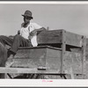 The waterboy, who takes water in his cart to the men working in the fields all day. Terrebonne Project, Schriever, Louisiana