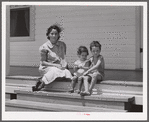 Wife and children of one of the cooperative's members on steps of their home. Terrebonne Project, Schriever, Louisiana