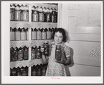 The canned goods closet, and chart (on door) of one of the project families. Terrebonne Project, Schriever, Louisiana