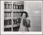 The canned goods closet, and chart (on door) of one of the project families. Terrebonne Project, Schriever, Louisiana
