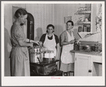 Mrs. Ruth Lina, home management supervisor, helping some of the project women can milk. Terrebonne Project, Schriever, Louisiana
