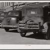 Crates of chickens on back of farmer's car. Port Gibson, Mississippi.