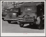 Crates of chickens on back of farmer's car. Port Gibson, Mississippi.
