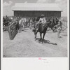 After the noon hour in the plantation yard, the mules, tractors and cultivators are taken out to finish the day's work. King and Anderson plantation, near Clarksdale. Mississippi Delta, Mississippi.
