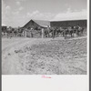 After the noon hour in the plantation yard, the mules, tractors and cultivators are taken out to finish the day's work. King and Anderson plantation, near Clarksdale. Mississippi Delta, Mississippi.