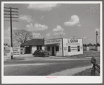 Signs advertising liquor stores are seen frequently along all Kentucky highways. South of Bardstown.