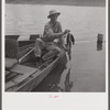 Boating and fishing along Cane River on Fourth of July near Natchitoches, Louisiana