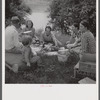 Farm family having fish fry on July Fourth along Cane River. Near Natchitoches, Louisiana