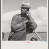 Member of Allen Plantation cooperative association resting while hoeing cotton. Near Natchitoches, Louisiana