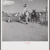 Members of the Terrebonne Project, Schriever, Louisiana, taking the mules from the barn out to the field after the noon hour