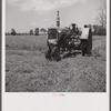 Member of Allen Plantation cooperative association running tractor near Natchitoches, Louisiana