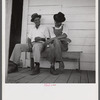 Melrose, Natchitoches Parish, Louisiana. [Multiracial people] sitting on the porch of country store and bar near John Henry cotton plantation