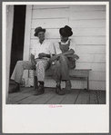 Melrose, Natchitoches Parish, Louisiana. [Multiracial people] sitting on the porch of country store and bar near John Henry cotton plantation