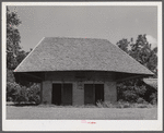 Melrose, Natchitoches Parish, LA. "African" house, probably a storeroom, smokehouse or jail when originally built by [multiracial people], now part of John Henry cotton plantation. He bought it from the Metoyier family in 1833. It was built and owned by them