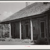 Melrose, Natchitoches Parish, Louisiana. Old home with mud walls built by [multiracial people], now a part of the John Henry cotton plantation. It was the original plantation house built and owned by Augustin Metoyier and called Yucca Plantation (from Spanish)