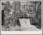 Melrose, Natchitoches Parish, Louisiana. Bedroom with religious pictures, etc. on mud walls of old hut built and still occupied by French [multiracial people], near John Henry cotton plantation. Belongs to Rocque family (see general caption)