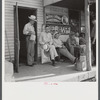 Farmers exchanging news and greetings in front of post office in Linwood, Kentucky.