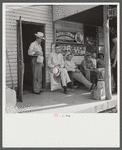 Farmers exchanging news and greetings in front of post office in Linwood, Kentucky.