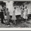 In the early fall many of the children remain away from school on "syrupping off" days. Sorghum syrup is boiled down from the cane sap by one of the men from the neighborhood who does this work for different members of the communities, taking a share of