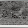 Homebuilt boiler pit made of mud and rocks where the sap from the sorghum cane is boiled down to the syrup. The man who does the cooking goes from one farm house to another and takes a share of the syrup for his work at the different mountaineers' homes