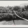 Carrying home groceries and supplies across the swinging bridge, Breathitt County, Jackson, Kentucky.