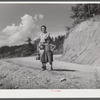 Mountain woman and child going home with groceries and supplies. Breathitt County, Kentucky.