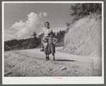 Mountain woman and child going home with groceries and supplies. Breathitt County, Kentucky.
