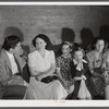 Mrs. Marie R. Turner, and David Donoho at a pie and box supper. Many parents and young people from the school and nearby communities attend the pie and box supper given by the school to raise money for additional repairs and supplies. Each box or pie is