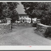 Home with old stone walls in bluegrass region near Lexington, Kentucky.