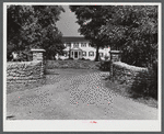 Home with old stone walls in bluegrass region near Lexington, Kentucky.