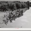 Members of the Primitive Baptist Church in Morehead, Kentucky, attending a creek baptizing by submersion.