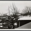 View of snow covered barns and outbuildings in backyard area. Hempstead, Hempstead