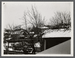 View of snow covered barns and outbuildings in backyard area. Hempstead, Hempstead