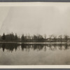 View of Artist Lake. Looking southwest from Middle Country Road. Formerly Glover's Pond, alias Curran's Pond. Boathouse in center. Middle Island, Brookhaven