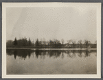 View of Artist Lake. Looking southwest from Middle Country Road. Formerly Glover's Pond, alias Curran's Pond. Boathouse in center. Middle Island, Brookhaven