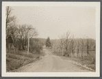 View of Middle Country Road. Looking west to Daniel Brewster house (in hollow). Middle Island, Brookhaven