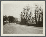 View of Montauk Highway. Looking east. S. Carman house (1858) on left. E.G. Durgen house (1873) on right. South Haven, Brookhaven