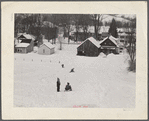 Children sleigh riding down hill in center of town. Woodstock, Vermont.