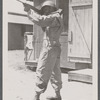 Man in uniform standing with rifle