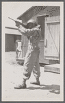 Man in uniform standing with rifle